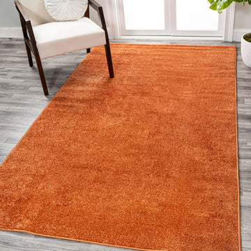 Haze Solid Low-pile Area Rug Orange